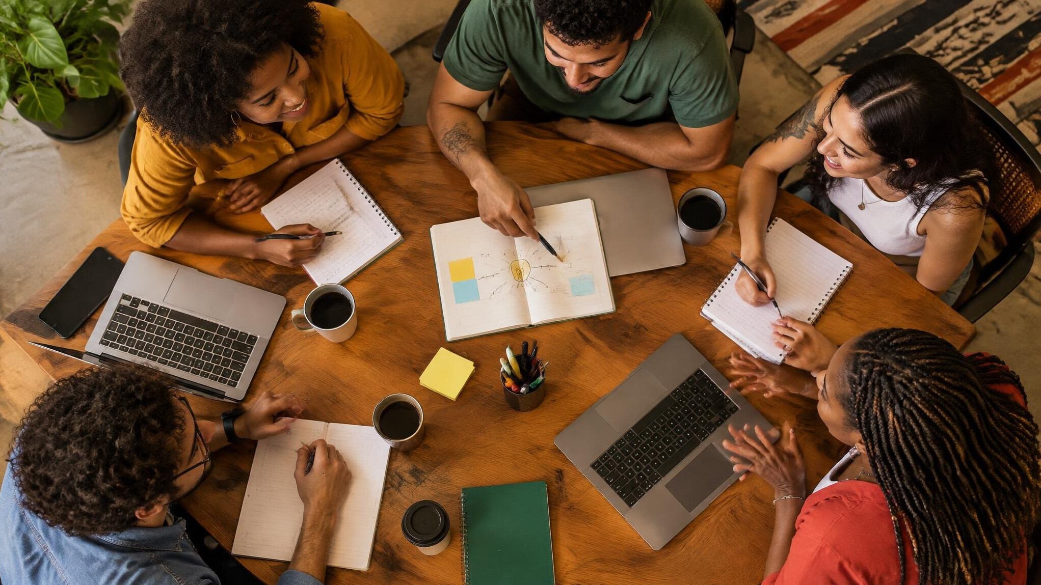 People sharing ideas around a meeting table
